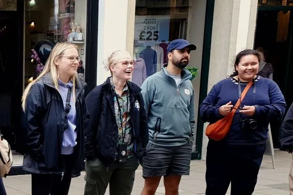 A group of four people enjoying an Oxford tour.